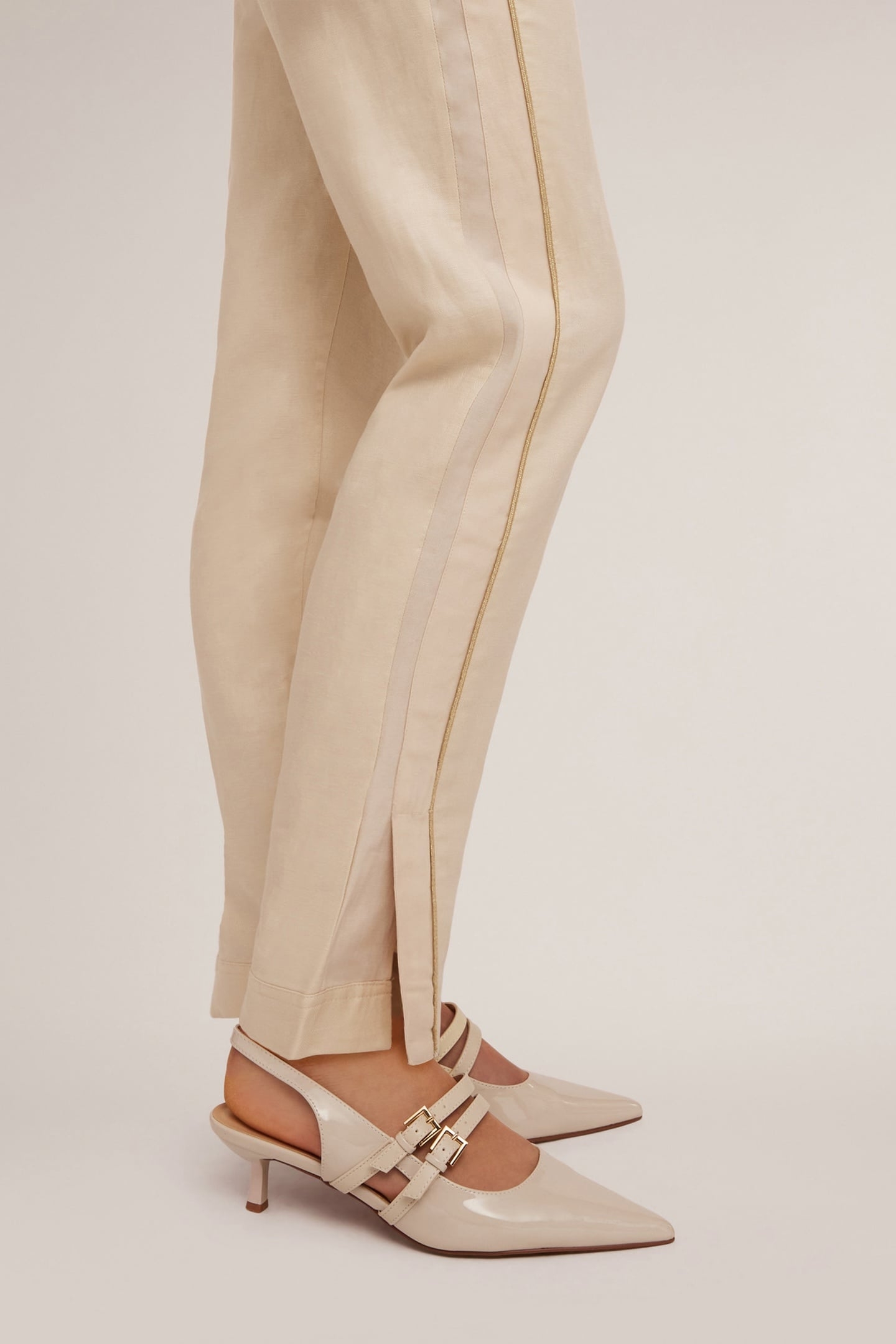 TROUSERS WITH PIPING AND SLIT AT THE HEM BEIGE 7